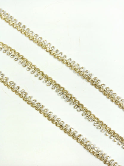 Metallic gold (double shaded) lace trim with rhinestones.