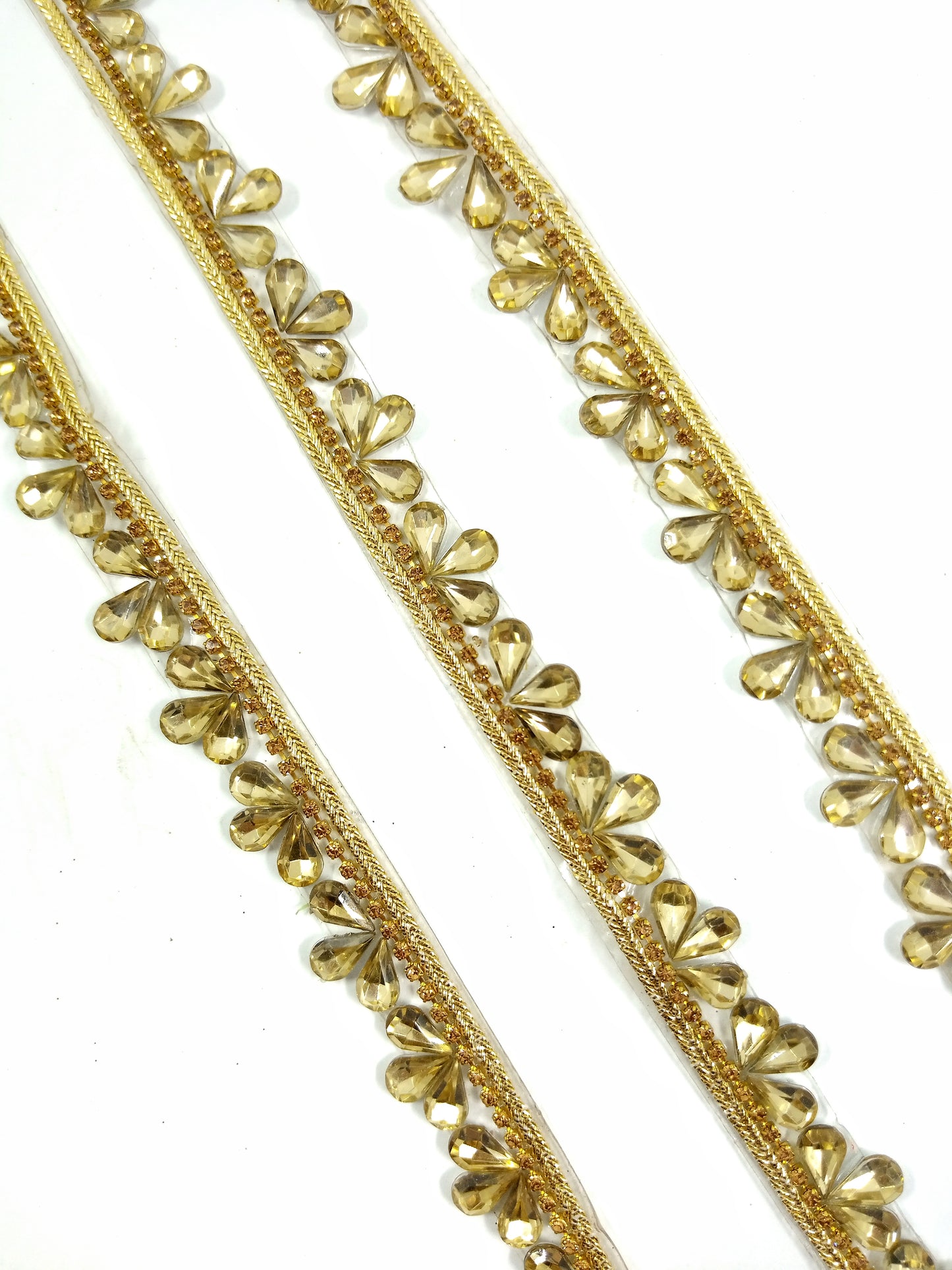 golden brown sleek crystal teardrop stone lace