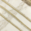 Metallic gold (double shaded) lace trim with rhinestones.